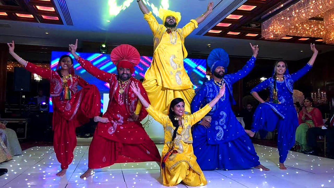 Bhangra dancers with vibrant turban and traditional attire